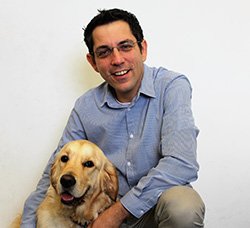 Dr Tamir Spiegel with a golden retriever